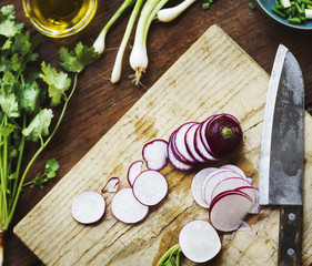 Closeup of fresh radish on wooden cut board