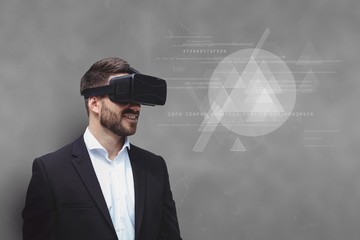 Man in VR headset looking at interface against grey background