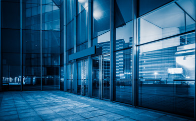 square front of modern office buildings in Shanghai financial district.