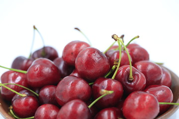 The big cherries are on a white background