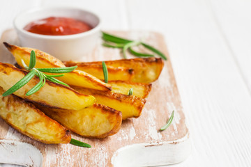 Baked potatoes with red sauce, selective focus