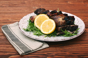 Roast fillet leg of lamb with greens and lemon