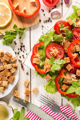 Caesar salad on rustic background.