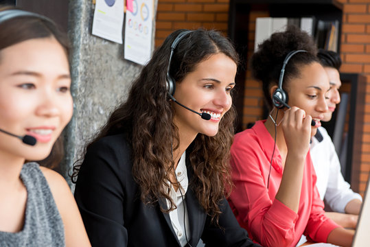 Multiethnic business team working in call center