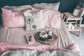Fototapeta na wymiar Black and pink bedroom in loft style