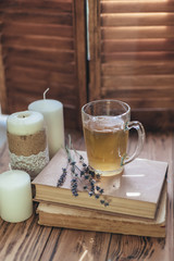 Herbal tea and reading on rustic windowsill