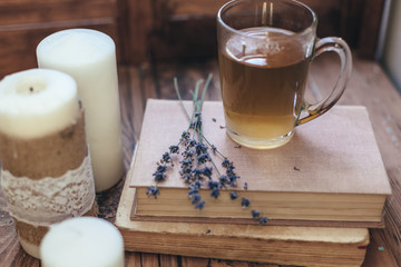 Herbal tea and reading on rustic windowsill