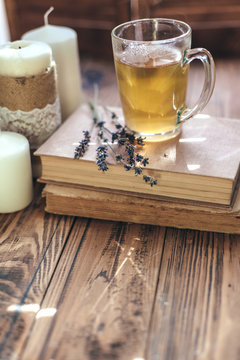 Herbal tea and reading on rustic windowsill