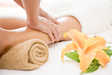 Obraz na płótnie Canvas Professional therapist giving leg massage to a woman