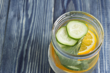 Detox water with orange and cucumber. Health and body cleansing.