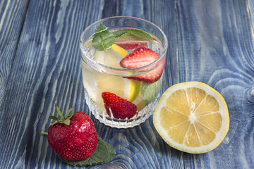 Detox water with strawberries and lemon. Health and body cleansing.