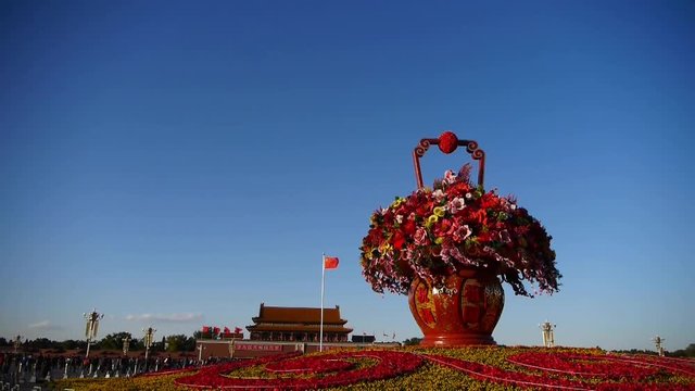 gorgeous baskets full of flowers in blue sky.Beijing Tiananmen Square sunny.