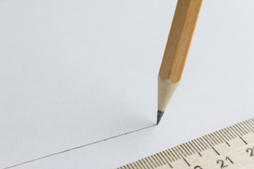 Pencil and wooden ruler. Drawings and measurements.