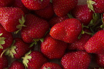 Strawberry background. A lot of ripe and appetizing strawberries. Healthy food.