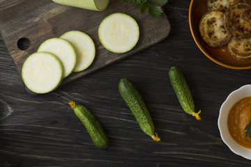 Cucumbers on a wooden table. Useful vegetables. Healthy eating.
