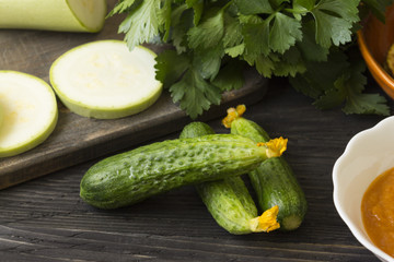 Cucumbers on a wooden table. Useful vegetables. Healthy eating.