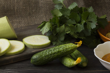 Cucumbers on a wooden table. Useful vegetables. Healthy eating.