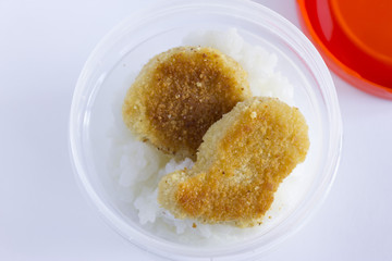 Nuggets with rice. Lunch in the lunch box. Delicious and hearty snack. Replenishment of energy.