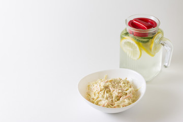 Cole Slaw Salad in white bowl. Delicious and useful cabbage salad. Healthy food.