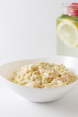 Cole Slaw Salad in white bowl. Delicious and useful cabbage salad. Healthy food.