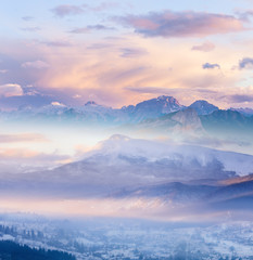 Winter Alpine mountains snowy landscape at sunrise