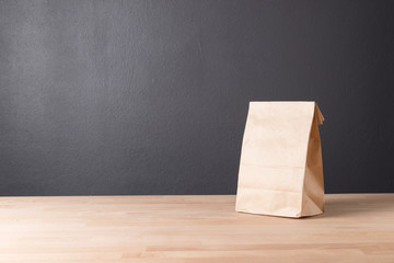 simple brown paper bag for lunch or food on table