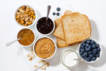 peanut butter, jams and toasts for breakfast, top view
