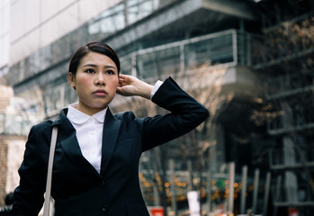 young businesswoman standing on the street