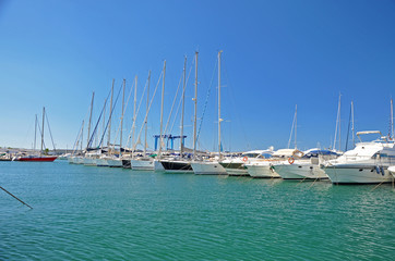 Fototapeta premium Sunny morning in the marina of Salerno with white yachts