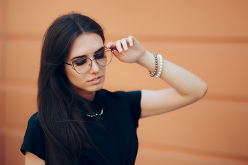 Elegant Fashion Woman with Trendy Eyeglasses and Pearl Accessories