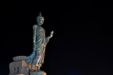 Walking image of Buddha posture / Walking image of Buddha posture at night in Phutthamonthon, The Thai center  of Buddhism located in Nakornpathom Thailand