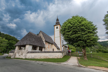 Fototapeta na wymiar Church of Sv. John the Baptist by the Bohinj lake, Slovenia