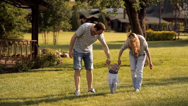 Young parents in the Park walking her child students