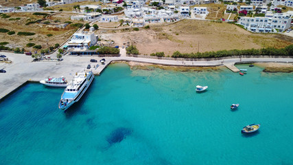 Fototapeta na wymiar Aerial drone photo of iconic port of Koufonissi beach with docked fishing boats and turquoise waters, Koufonissi island, small Cyclades, Aegean, Greece