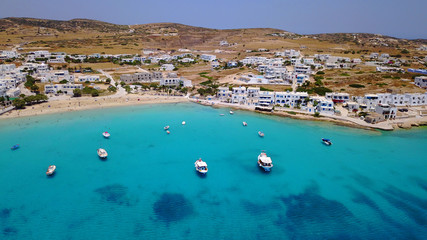 Obraz premium Aerial drone photo of iconic port of Koufonissi beach with docked fishing boats and turquoise waters, Koufonissi island, small Cyclades, Aegean, Greece