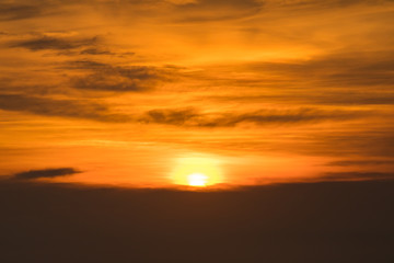 Fototapeta na wymiar sunset time over the golden sky.