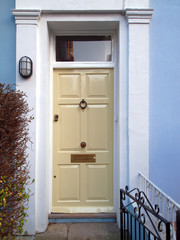 Notting hill, London, elegant pale white entrance door