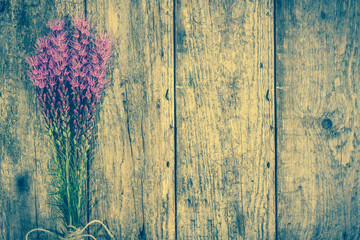 Rustic flowers bouquet on aged wood, copy space