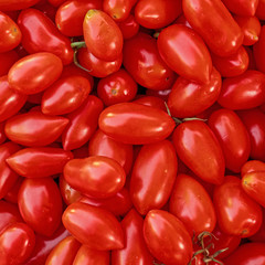 vibrant red cherry tomatoes closeup, top view