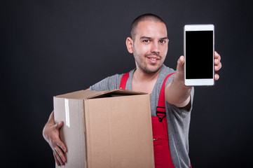 Mover man holding box showing smartphone blank screen
