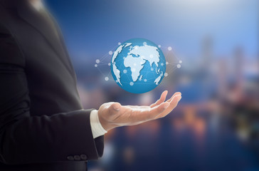Businessman holding Earth graphic on hand , communication and network internet concept