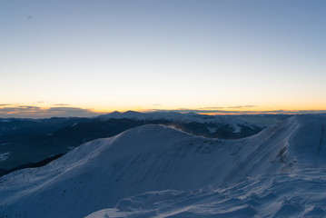 Naklejka na ściany i meble scenic sunrise, sunset in the winter mountains. mountain range