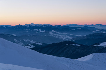 Fototapeta na wymiar scenic sunrise, above the winter mountains. mountain range
