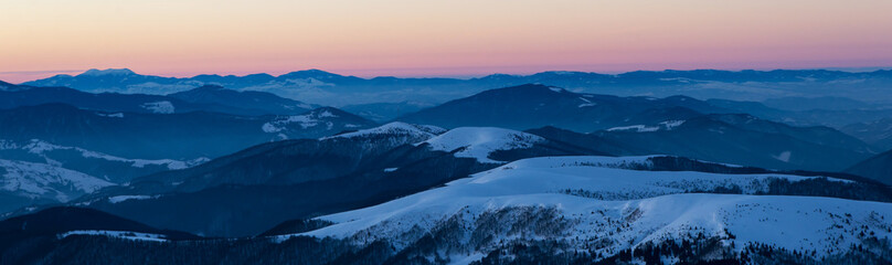 Naklejka na ściany i meble scenic sunrise, sunset in the winter mountains. mountain range panorama