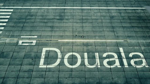 Aerial view of big airplane arriving to Douala airport. Travel to Cameroon conceptual intro animation