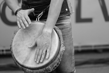 The ethnic drum is in the hands of the member of the Baltic Drum Summit 2017 during the performance of the composition. Riga, Latvia.