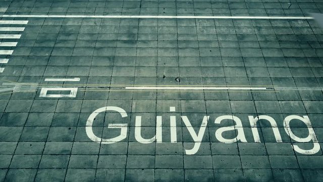 Aerial view of big airplane arriving to Guiyang airport. Travel to China conceptual intro animation
