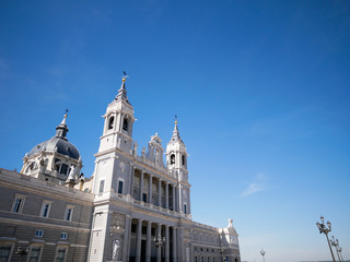 Fototapeta na wymiar Side view of Cathedral de la Almudena (Santa Maria la Real de la Almudena) in Madrid, Spain.