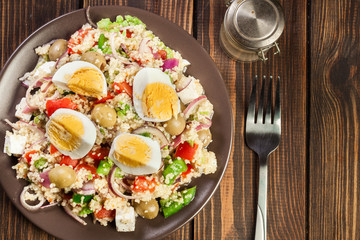 Fresh salad with couscous and eggs