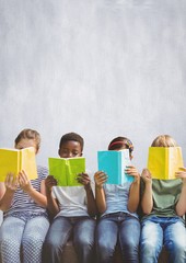 Group of children reading books in front of bright background